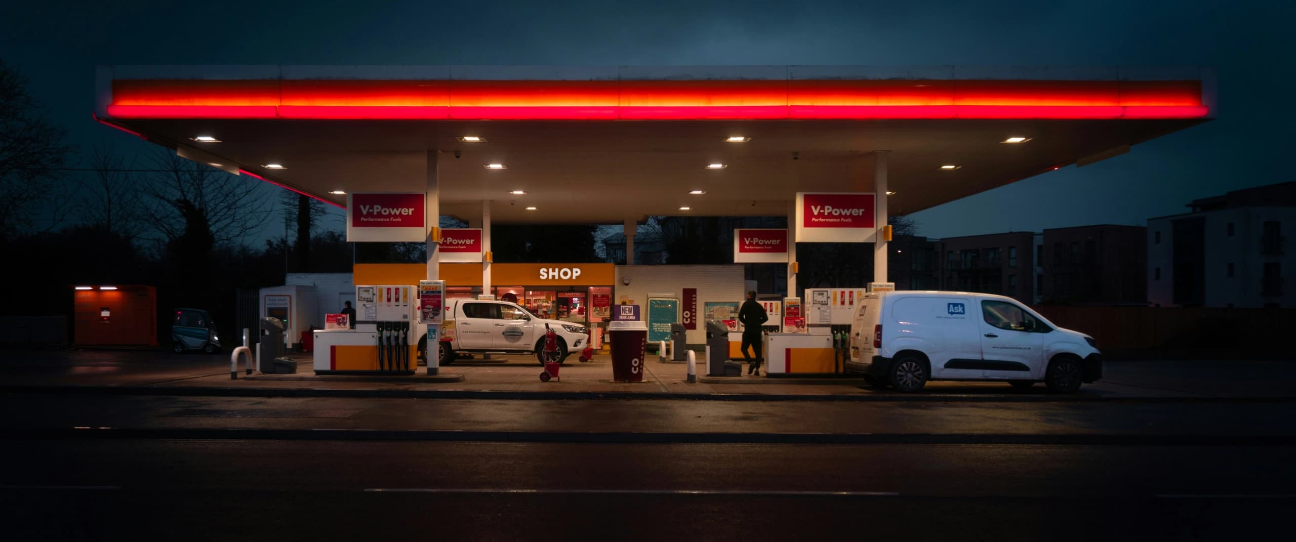 dark approach to a gas station at night